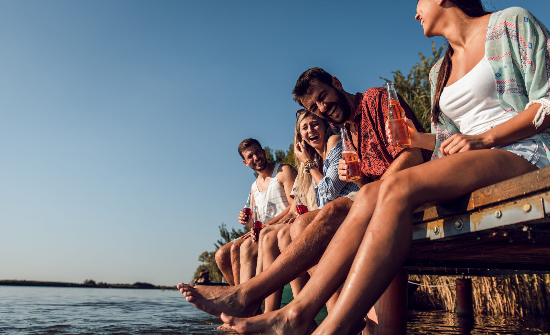 Friends on the pier at sunset