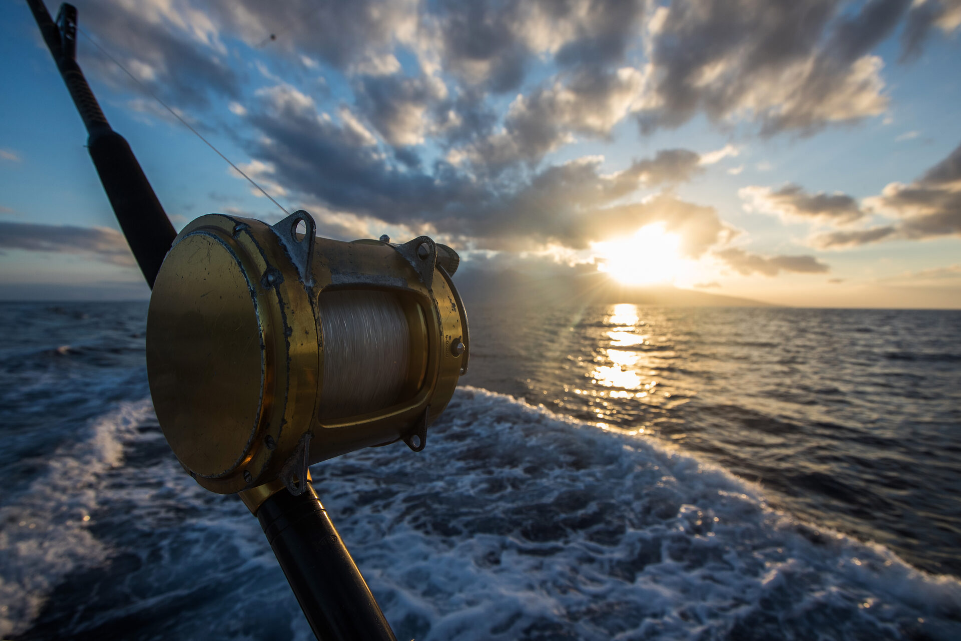 Deep sea fishing at sunrise